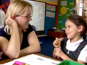 Teacher and student smiling