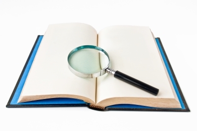 book with magnifying glass