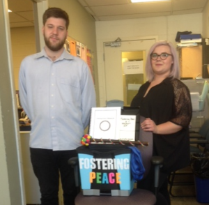 George Brown students Karoline Medeiros and Daniel Entwistle pose with the restorative resource kit they developed.